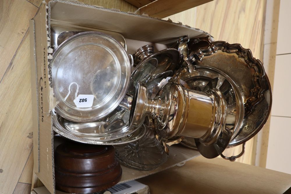 A quantity of silver plated including two silver plated tea sets, a salver and a two branch candelabra and cutlery, in a trunk